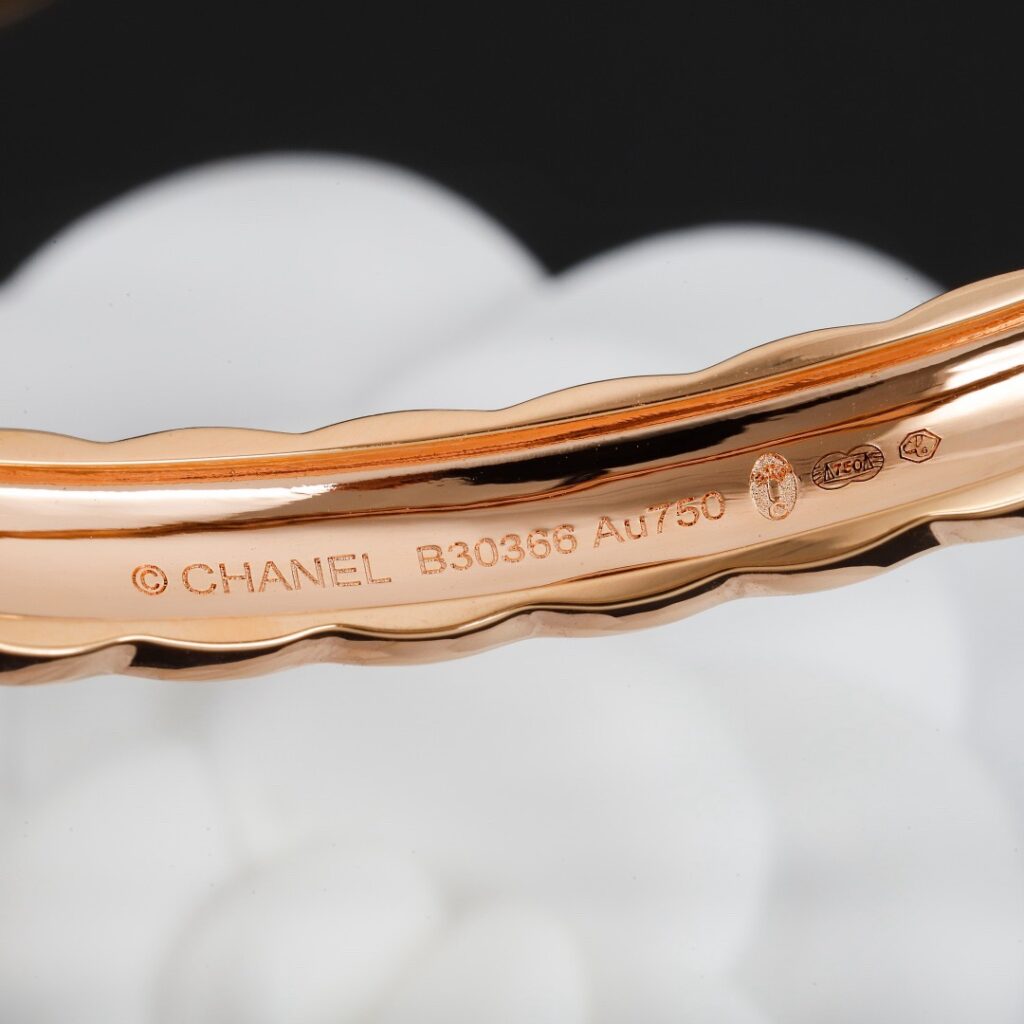 Gold and silver minimalist necklaces with engraved spherical pendants, styled for quiet luxury fashion and everyday elegance across different price ranges.