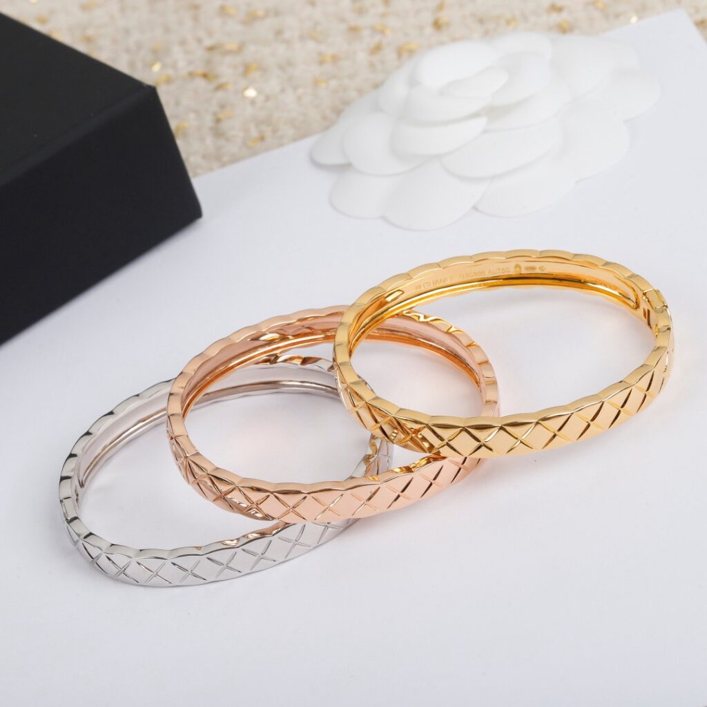 Elegant gold and silver bangle bracelets featuring quilted detailing inspired by the Coco Crush aesthetic — minimalist luxury pieces curated for timeless sophistication.