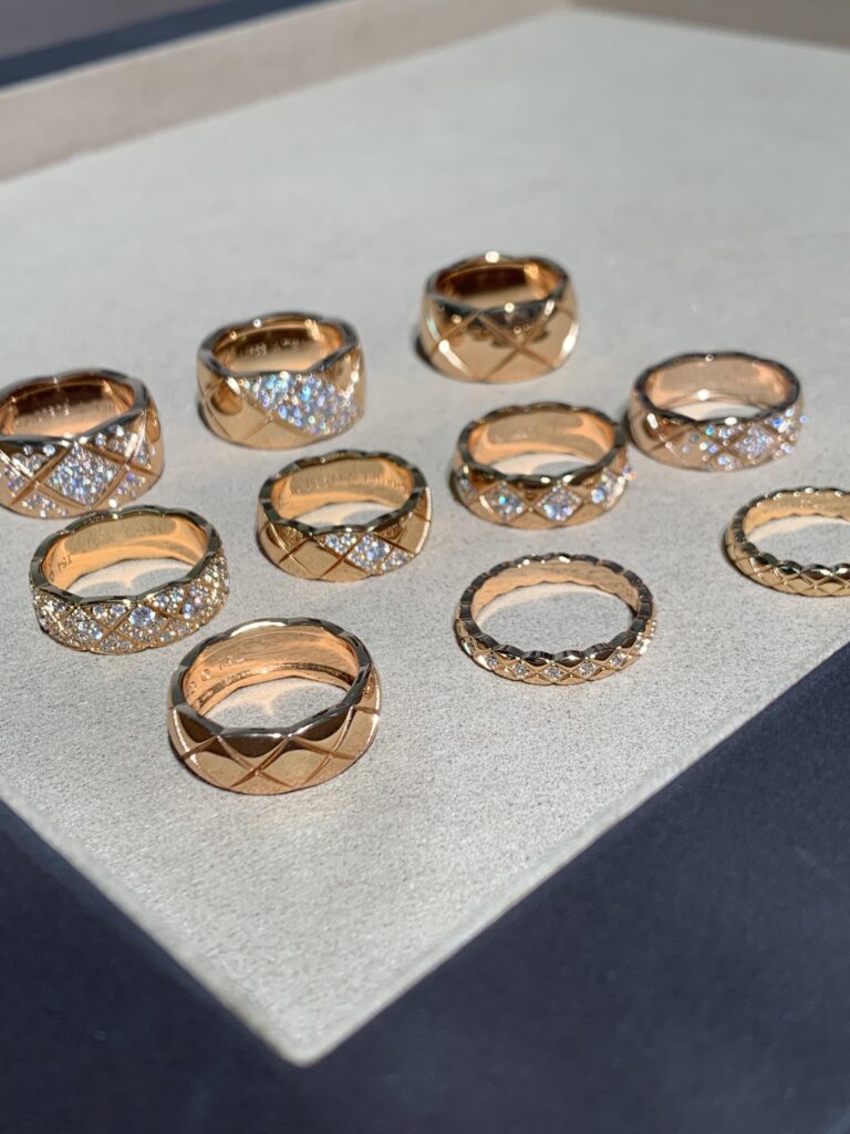 Elegant gold and silver chain bracelets with quilted and C-shaped pendants photographed on a beige background — minimalist quiet luxury jewelry that looks expensive for less, perfect for daily wear or gifting.